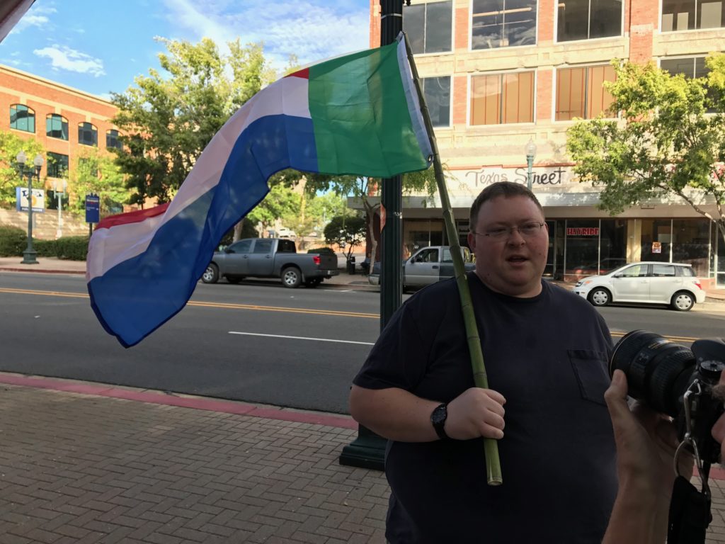A man holds the flag of Transvaal flag in Shreveport Louisiana